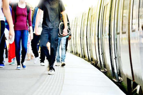 Stock photo of people leaving a train